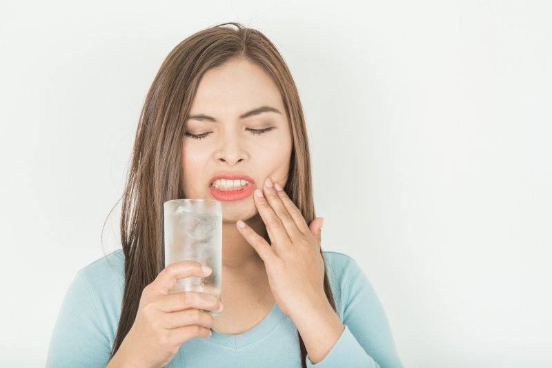 Woman with tooth sensitivity